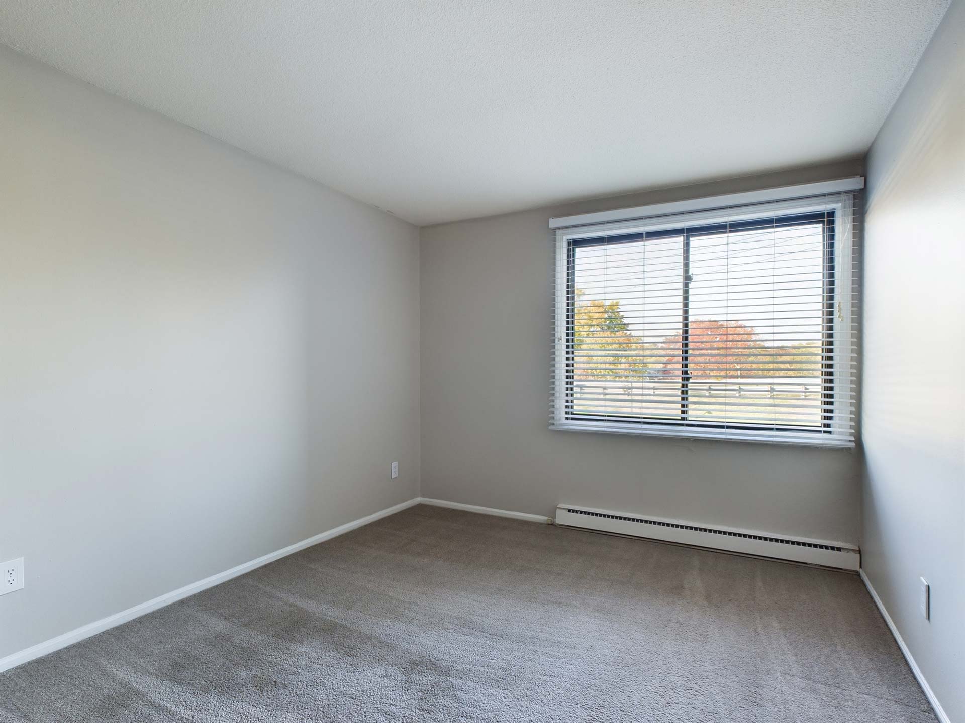 empty room with carpet and window in a house at The Edgewater